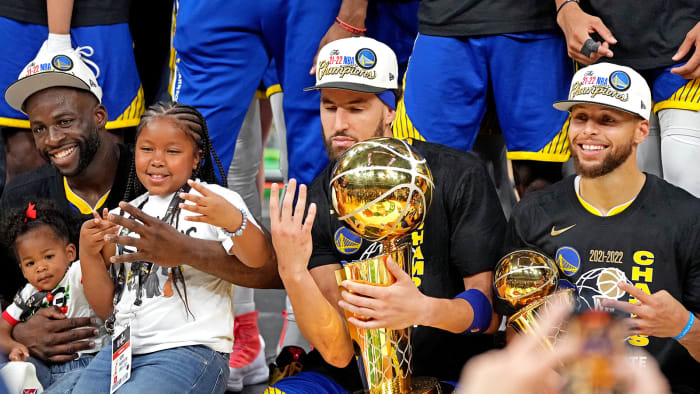 Golden State Warriors forward Draymond Green (23), guard Klay Thompson (11) and guard Stephen Curry (30) celebrates after beating the Boston Celtics in game six of the 2022 NBA Finals.